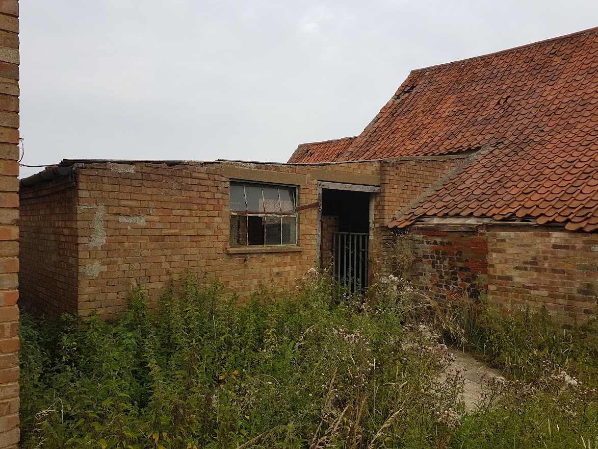 An empty building with broken windows