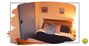 The Old Barn Master Bedroom, comfy and cosy with a partial sea view