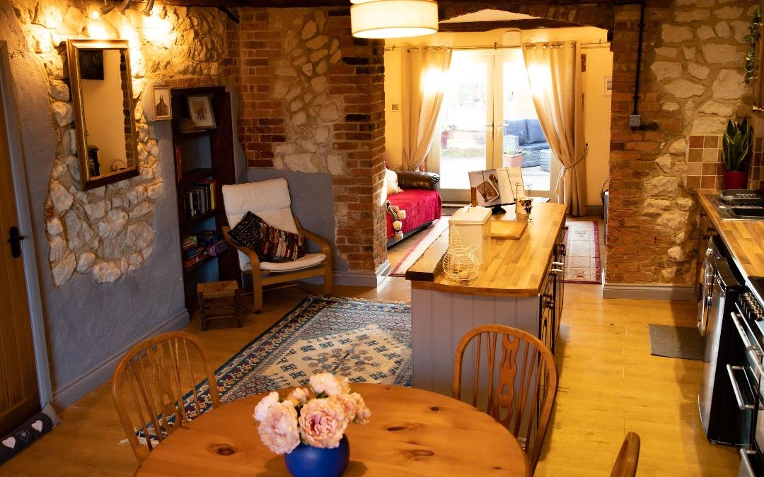 Self-catering holiday cottage open plan living room  and kitchen in the old barn