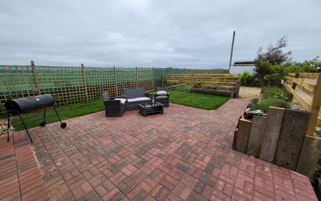 Norfolk Coastal Cottages, The Dairy has a large private garden with seating area perfect for families to gather together around a fire in the evenings to watch the sunset 