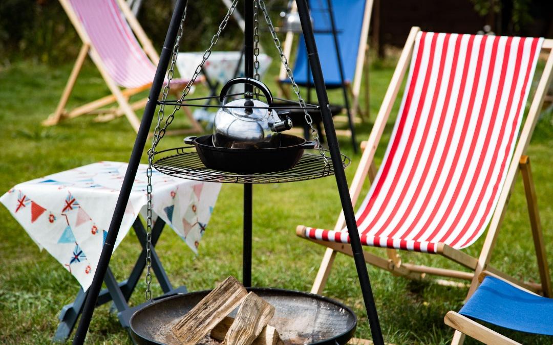 Outside deckchair seating and firepit with bbq outside of our glamping shepherds huts