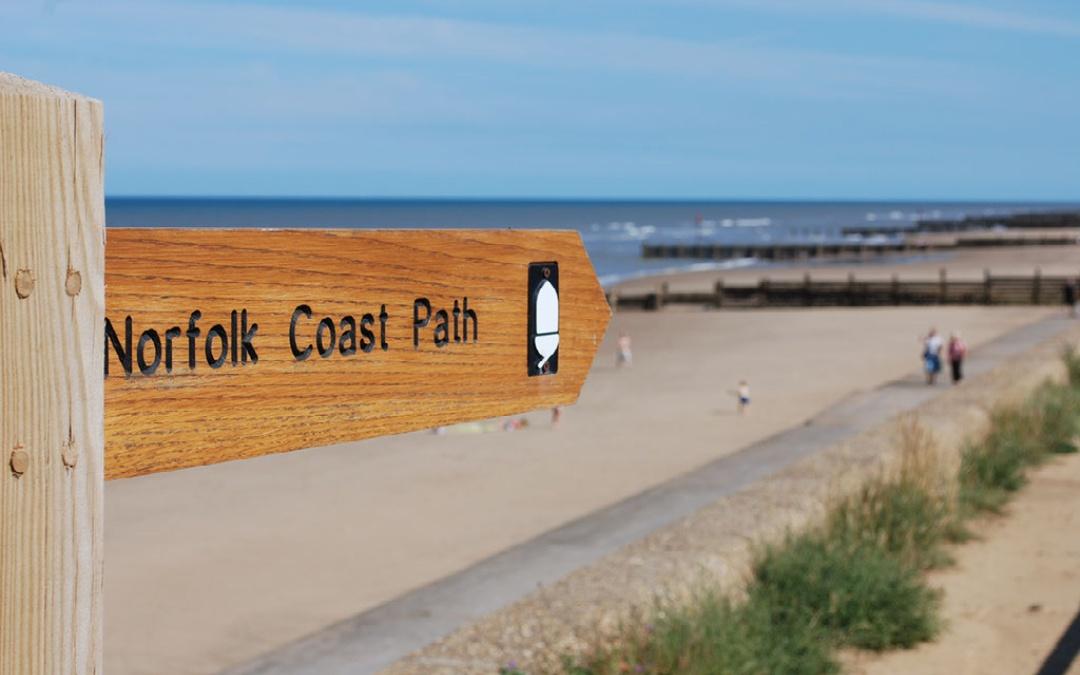 The Norfolk coast path sign on the beach