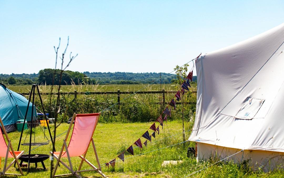 glamping bell tents with open meadow views