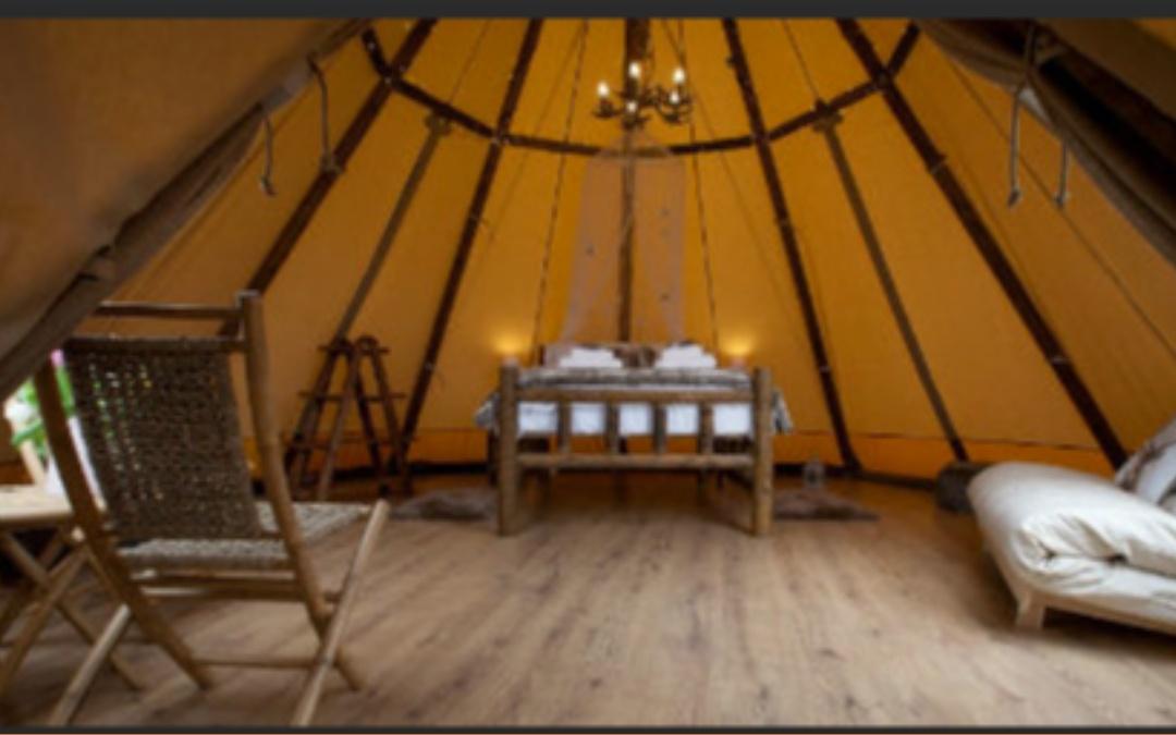 glamping wigwam inside view with double bed
