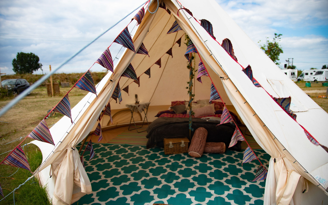 mYminiBreak, Hunstanton Glamping, an inside view of our Glamping bell tents with comfy bed and boho decor