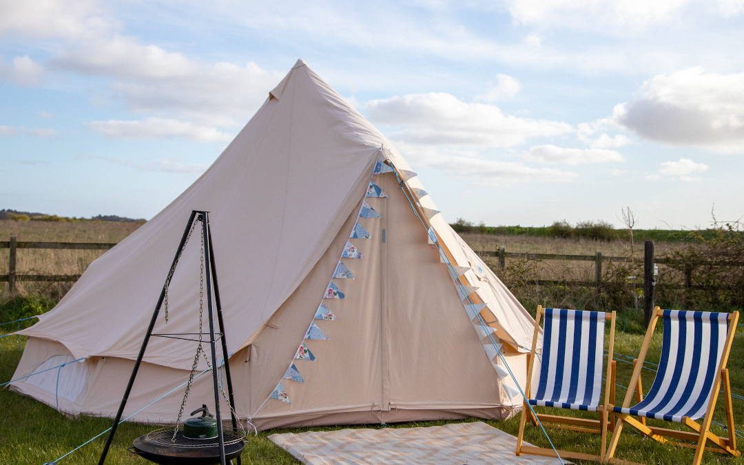 Our blank canvas bell tents with views out over the Norfolk Countryside here at Hunstanton Glamping