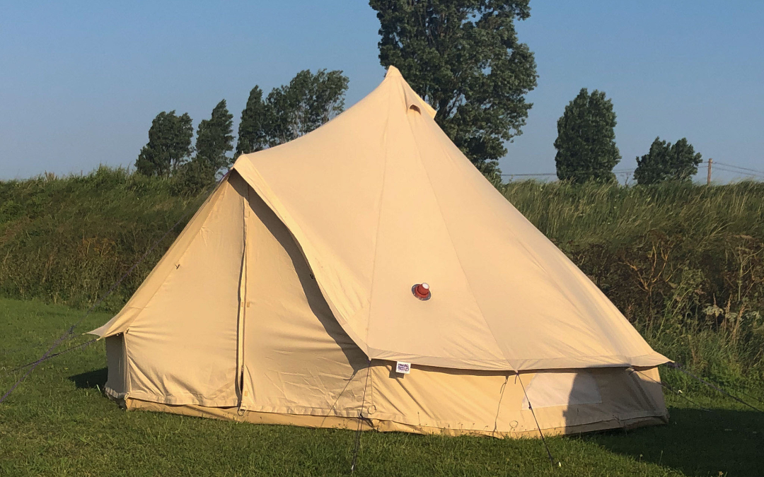 Our blank canvas bell tents with views out over the Norfolk Countryside here at Norfolk Coast Path Glamping