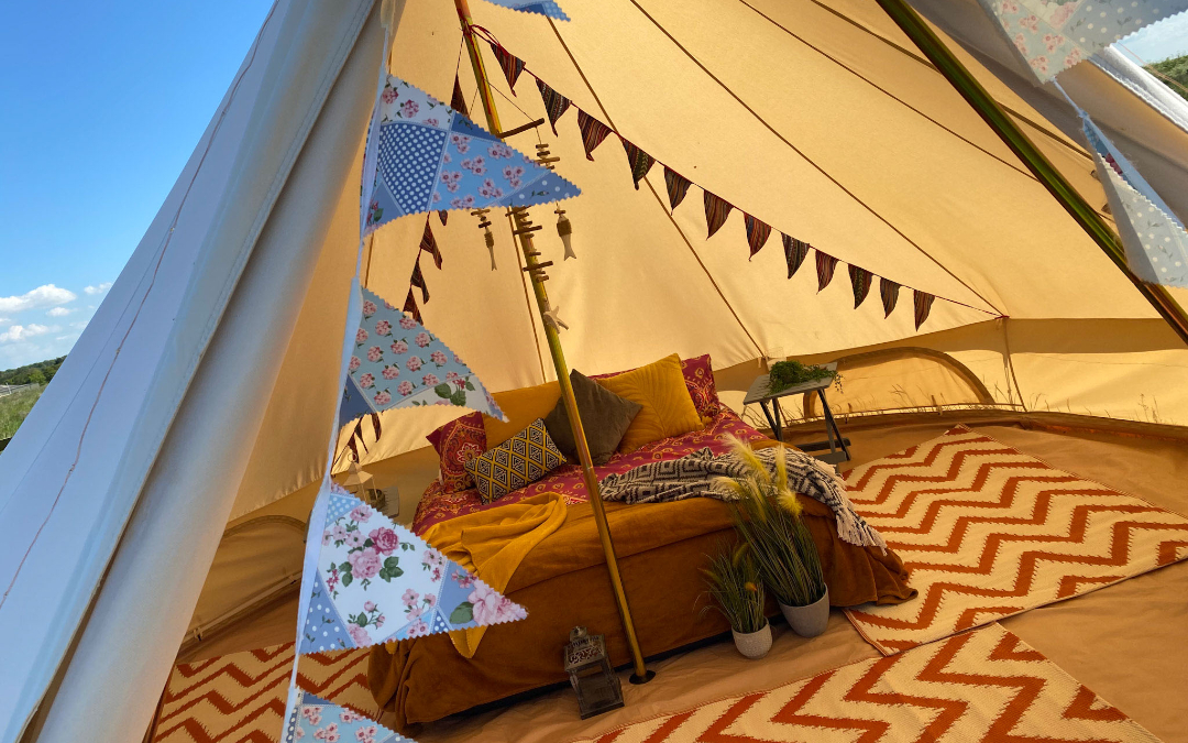 an inside view of our boho style glamping bell tents here at Norfolk Coast Path Glamping