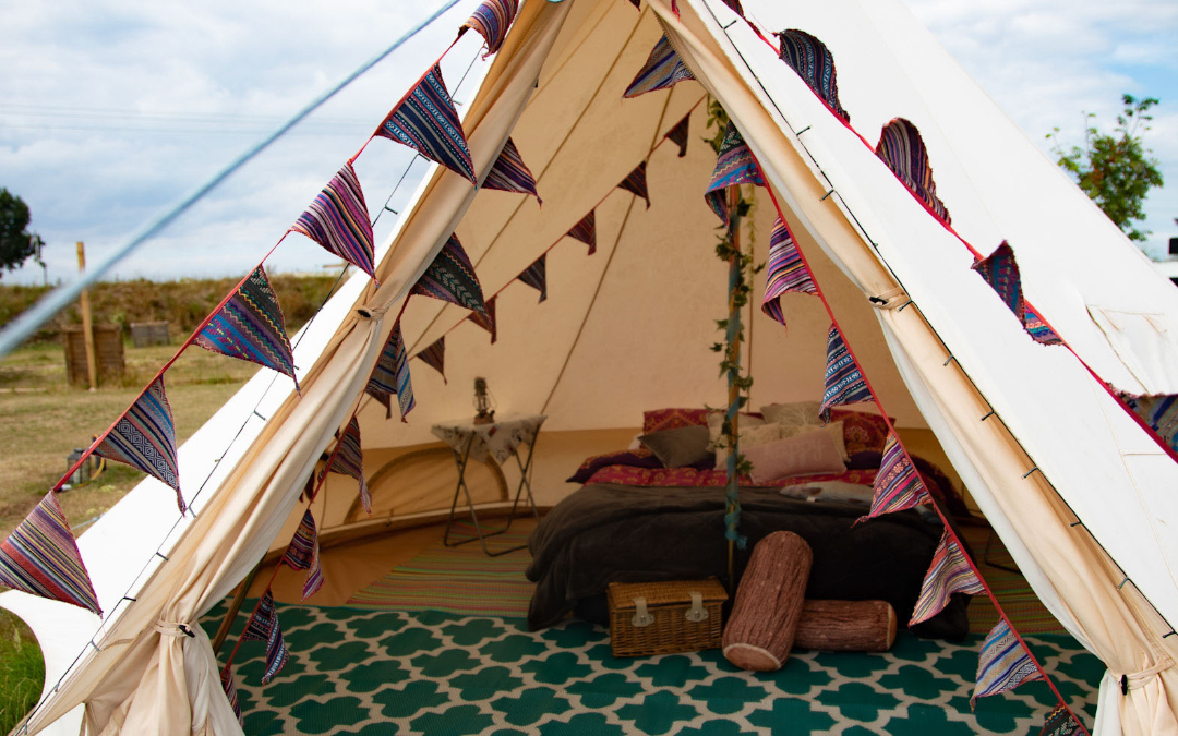 A look inside our glamping bell tents, with comfy double beds and stylish furnishings here at North Norfolk Glamping