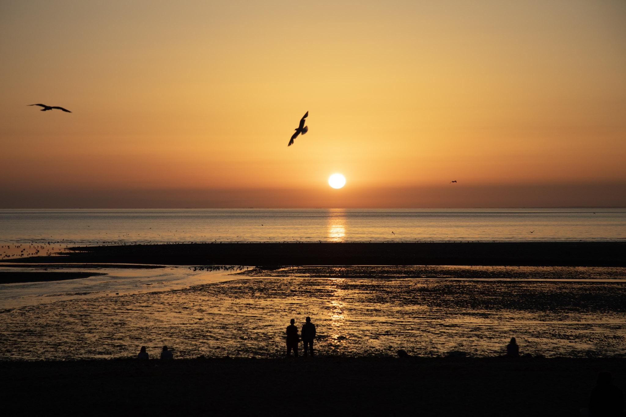 View of the stunning sunset over the sea on Heacham South Beach