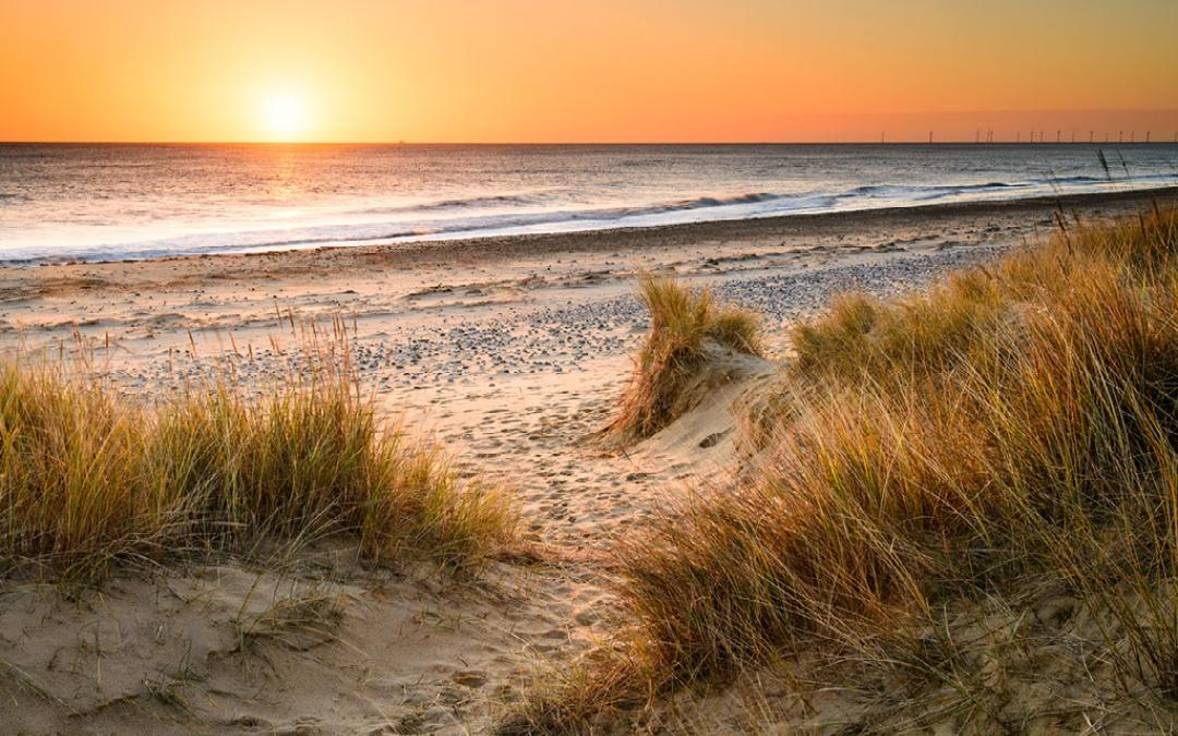 Enjoy a stunning sunset over the sea with your loved one at Hunstanton Glamping