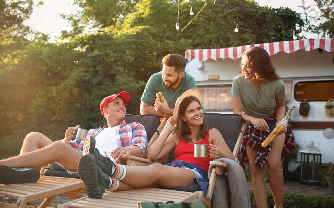 friends hanging out outside of a campervan