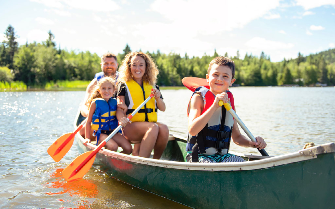 family canoeing in a lake