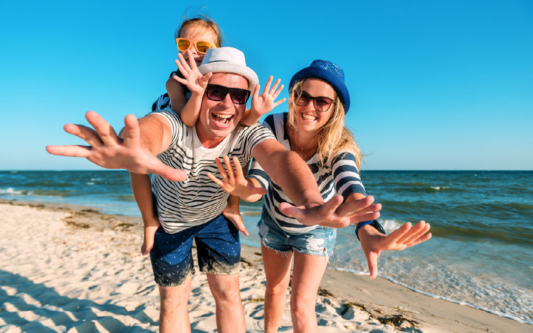 family having fun on a sunny beach