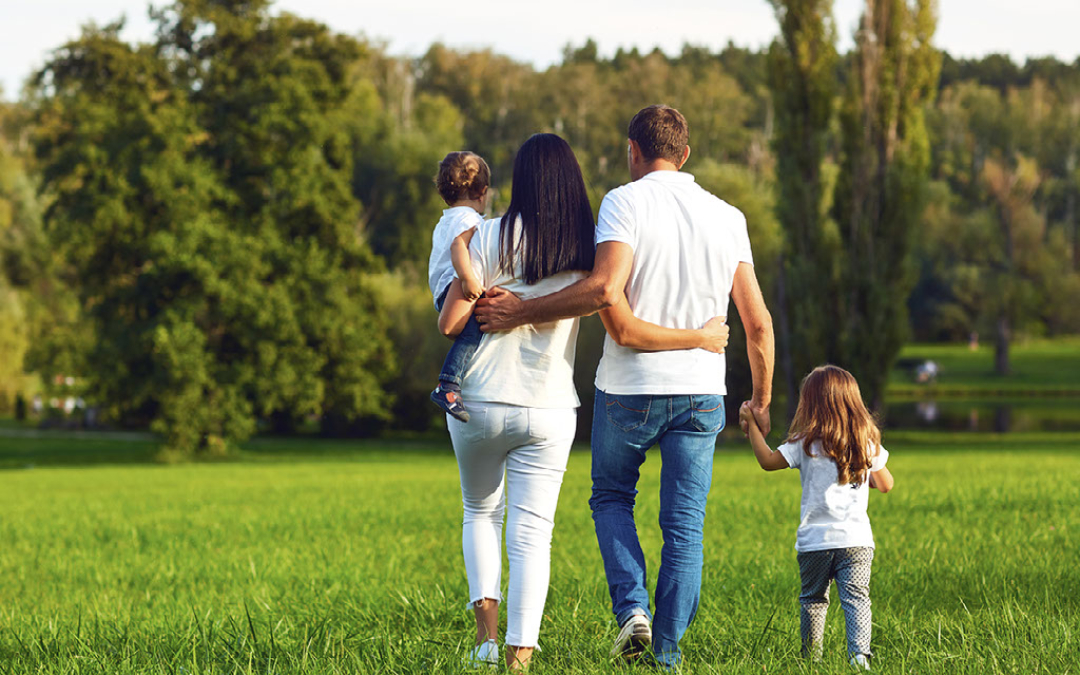 framily walking through a field