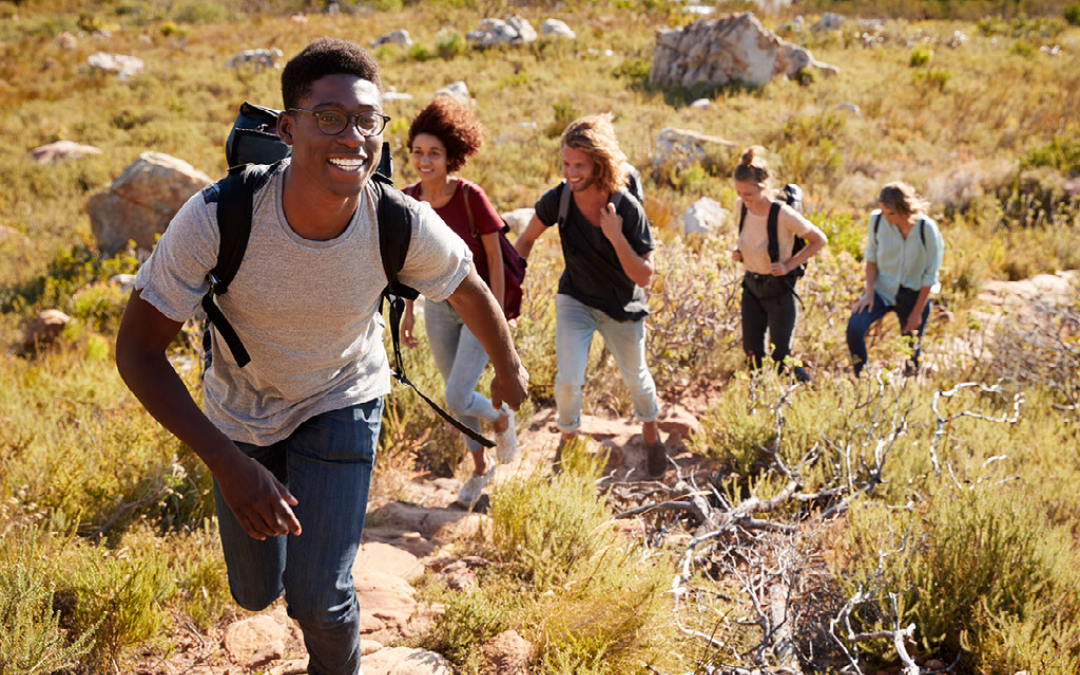 young adults group hiking