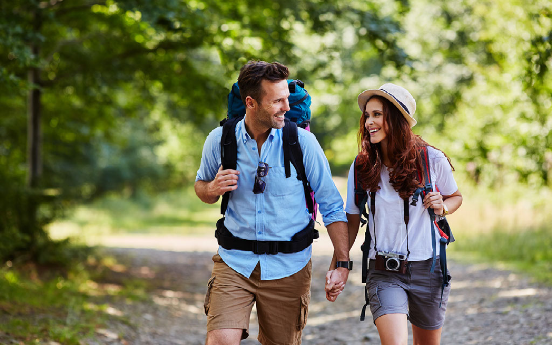 couple hiking through woodland