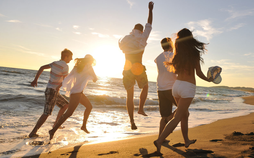 young adults sandy beach sunset