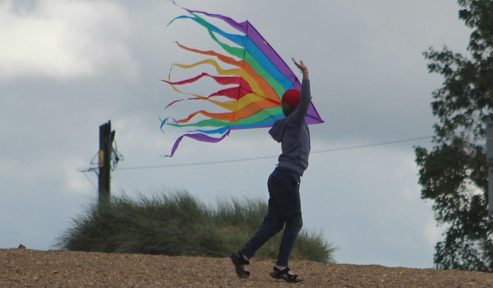 Come fly your kite South Beach Heacham, young boy fling his kite