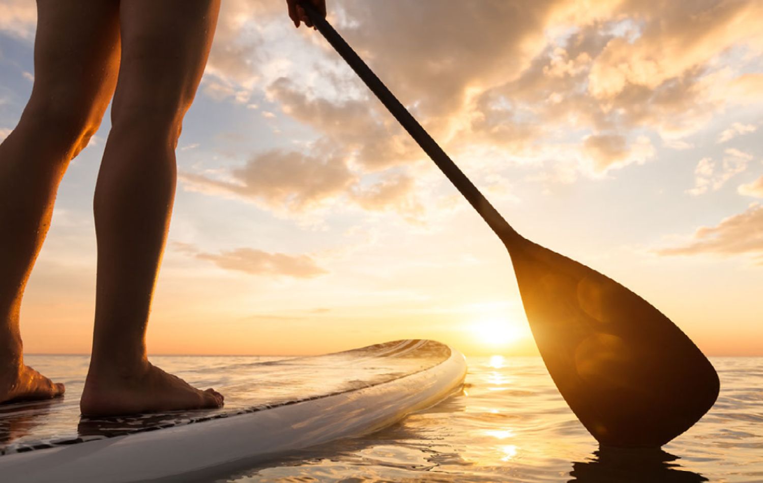 paddleboarding in the wash during sunset