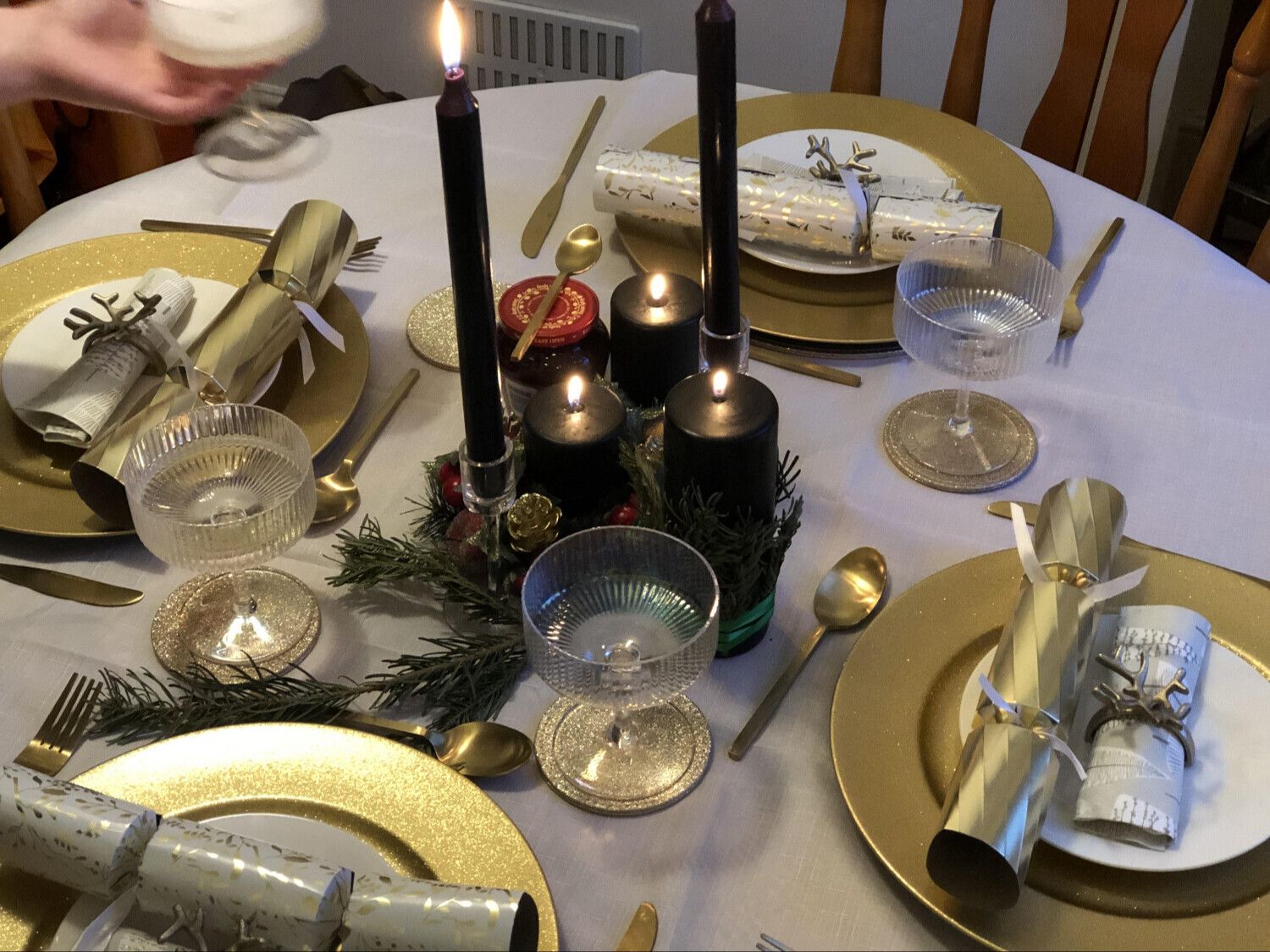 Set table with Christmas crackers on the plates