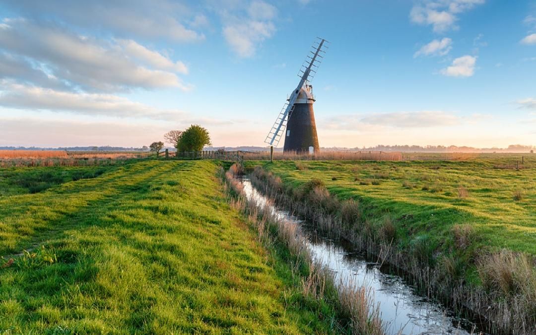 The Norfolk Broads windmill open heathland stream river