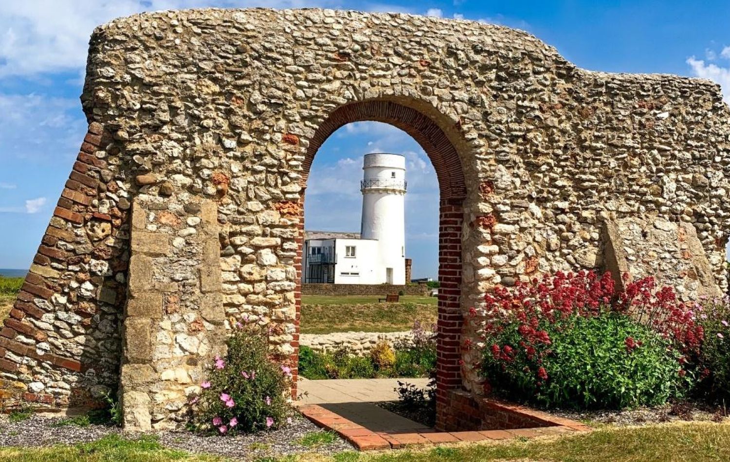 ruins of st edmund's chapel with the hunstanton lighthouse in the doorway