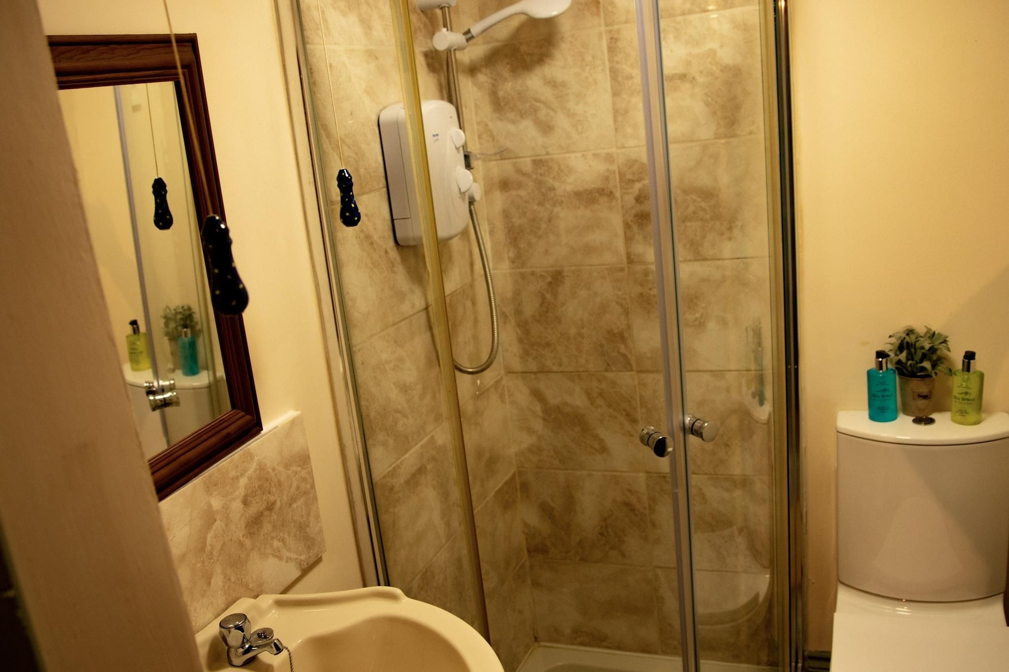 en-suite bathroom with a shower