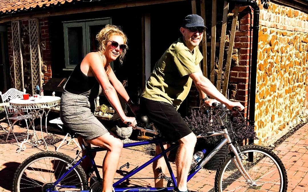 couple on a tandem bike