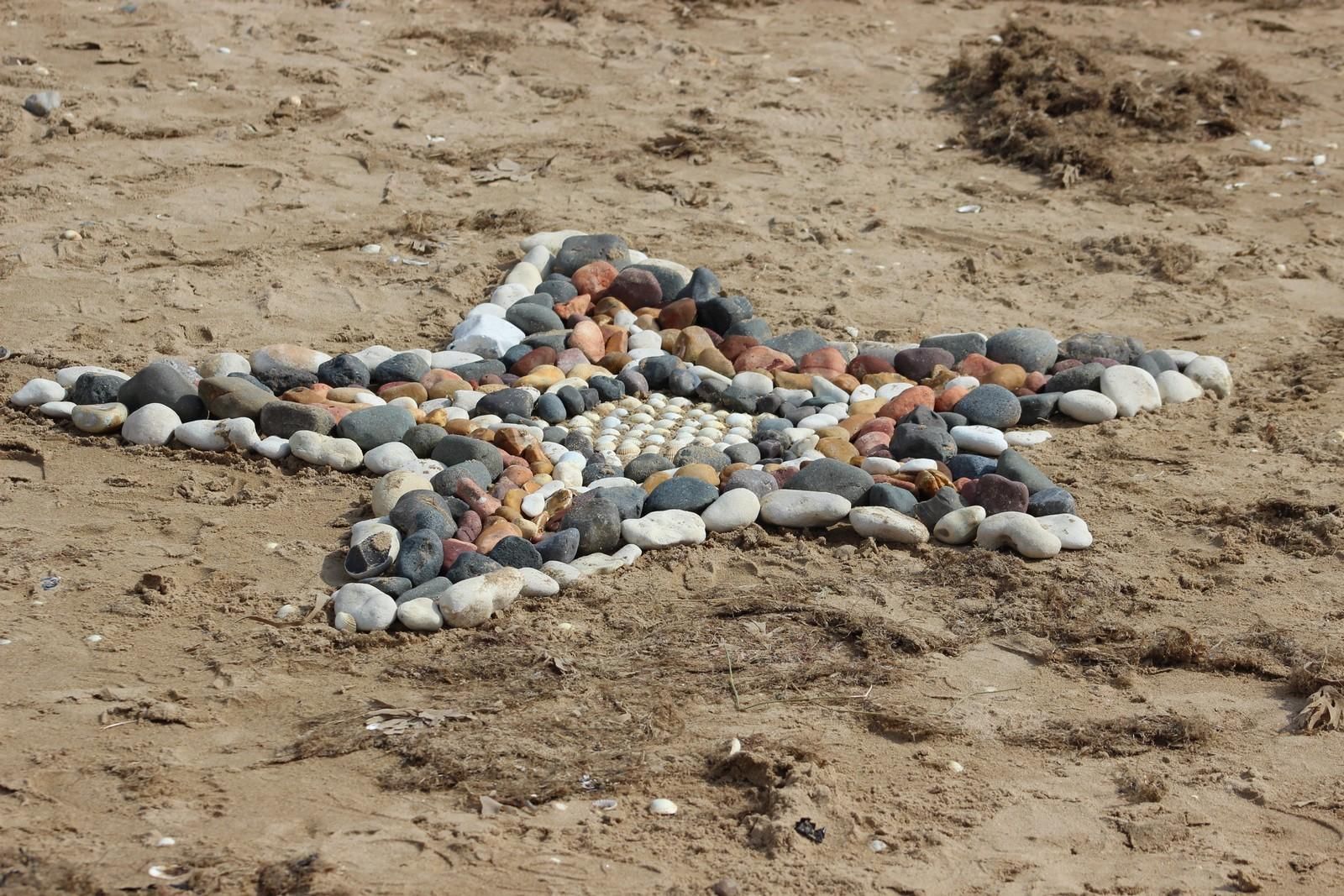 Stones starfish make by children on our sandy beach
